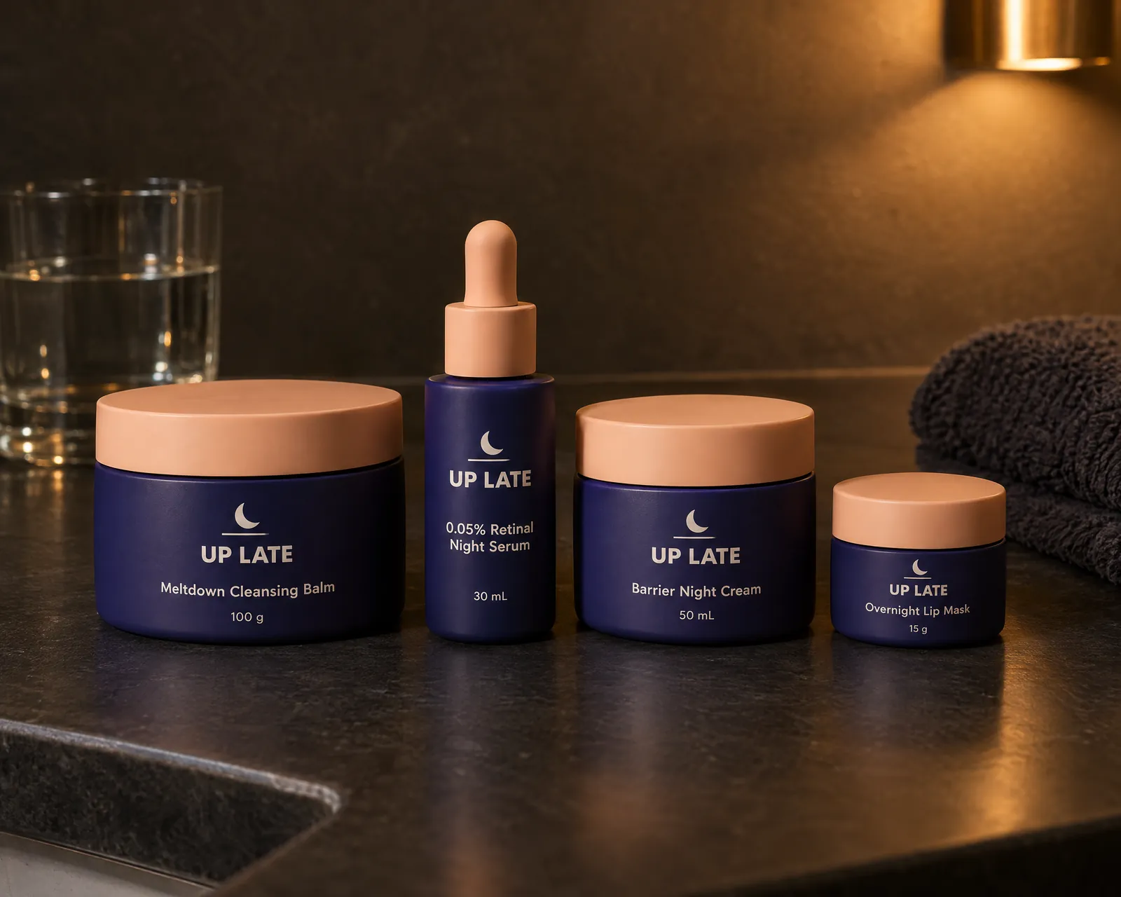 The four Up Late night products on a dark counter under a warm wall light